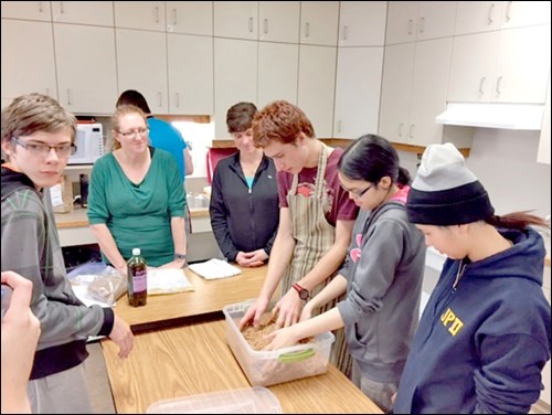 City of North Battleford Environment Manager Tammy McCormick demonstrates the Bokashi method of composting to John Paul II functionally integrated students. Photos submitted