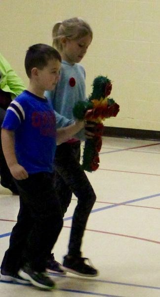 Zaiden Rudachyk, left, and Brea Babiarz laid a wreath at the Sturgis Elementary School Remembrance Day service on November 10.