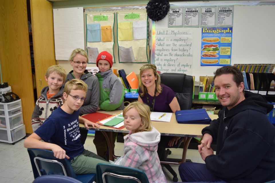 At a meeting with Leona Kitchen, back right, during the parent-teacher interviews at Canora Composite School, were: (back row) Simon, Jill and Henry Craig and (front) Jack, Greta and Tyler Craig.