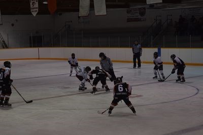 Logan Wolkowski, centre, prepared for the puck to drop with Randi Foster at left wing and Hunter Lamb, an atom player, at defense at the Canora Peewee Cobras game against the Yorkton Premier Cabinets Terriers on November 20.