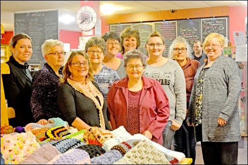 A knitting group in North Battleford has made their latest donation to Battlefords Early Childhood Intervention Program. This year the knitters decided to make blankets for the program's kids in time for Christmas. In total, the group of 12 women will donate 115 blankets to BECIP, after having kicked off the project in April. In the photo are members of the knitting group and Colleen Sabraw, executive director of BECIP. Photos by Shannon Kovalsky