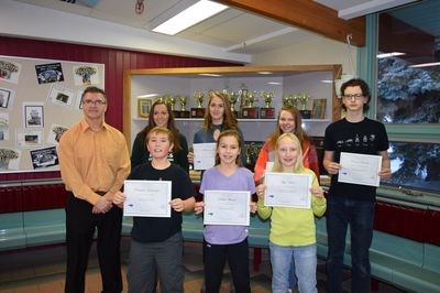 The people present when the students were awarded certificates, from left, were: (back row) Janayah Merriam (Grade 11 winner), Mackenzie Gulka (Grade 10), Larissa Makowsky (Grade 8) and Carson Barteski (Grade 9) and (front) Kim Eiteneier, Brayden Goetzinger (Grade 5), Robin Skurat (Grade 6) and Mya Wolos (Grade 7). Not available for the photo was Kayla Sheptak, the Grade 12 recipient for November.