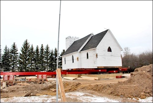 Langmeade Church was headed for oblivion when a group of community members pulled together to move the building onto a new foundation Nov. 29. The project is dedicated to the memory of Jack Higgins, who was a long-time activist for preservation of the structure. Photos by Sherri Hamilton-Beech