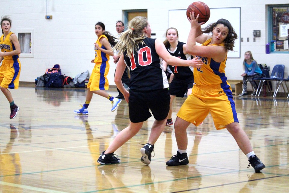 Jaylyn Schulkowsky of the John Paul II Crusaders junior girls’ basketball team controlled the ball after she stole it from a Unity Warriors player during a tournament game Saturday at John Paul II Collegiate.