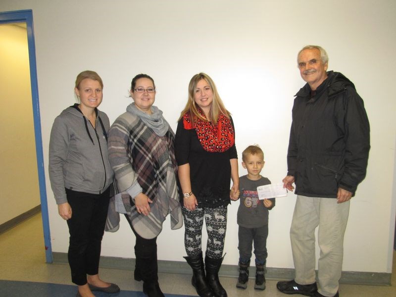 On November 30, Bryan Cottenie, right, a district delegate for Affinity Credit Union, presented a cheque of $1,500 from the Community Development Fund to the Victoria School Pre-Kindergarten and Kindergarten Family Events Group. From left were: Chantel Kitchen, a pre-K teacher; Kelly Lambert, a Kindergarten teacher; Tara Richardson, a parent, and Nixon Shabatura, a pre-K student.