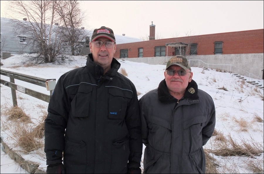 Morley Naylor and Frank Gira, former commanding officers of the now-defunct 21st Field Engineer Squadron, outside of the soon-to-be-demolished armoury.