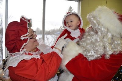 Three-week-old Winston Warren was all smiles when he visited Mrs. Claus and Santa.