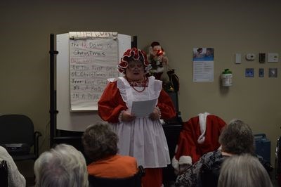 Mrs. Claus read a story to the residents of the Gateway Lodge about the troubles Santa faced preparing for Christmas in the modern age.