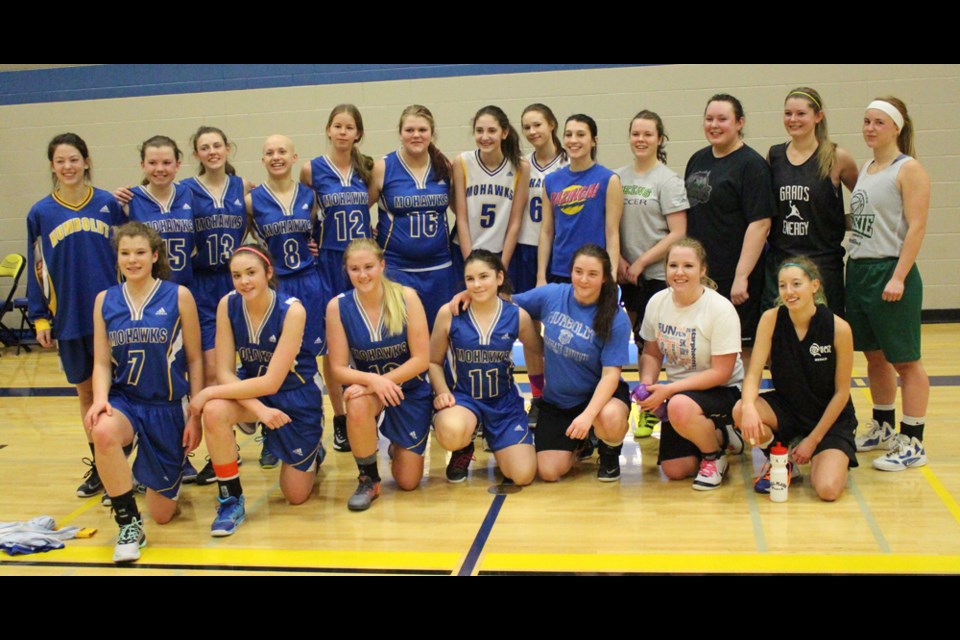 Current and former senior Mohawk basketball players faced off against one another in a pair of alumni games held on the HCI gym floor on Dec. 18. Pictured: Senior girls old and new. photos by Christopher Lee