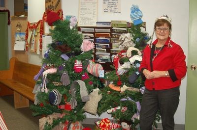 Hazel Urbanoski posed with the mitten tree.