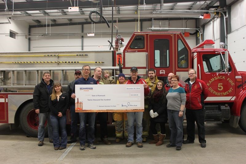 A cheque for $12,500 was presented by the Pioneer Grain company to the Kamsack Volunteer Fire Department on January 5. The money is to go towards the firefighters’ purchase of rescue equipment. With the oversized cheque, from left, were: Ed van Parys, Rose Boughton, Ken Thompson, Jack Blaht, Ryan Lambert, Karleigh Lambert, Darcy Green, Bruce Thomsen, Dillon Chernoff, Kristin Johnson, Jim Pollock (fire chief), Kamsack Mayor Nancy Brunt and Dave Hoffert.