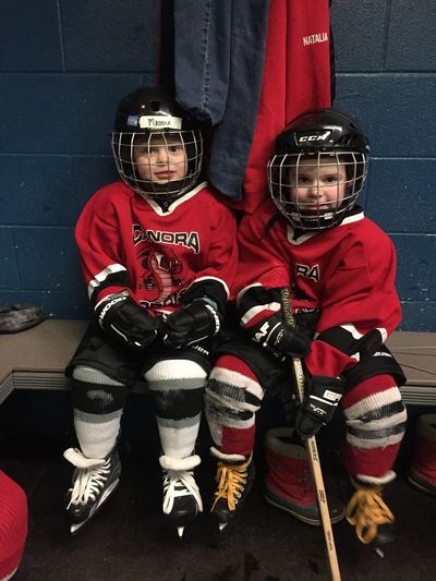 From left, Maddix Sawka of the White Squirts and Mason Reine of the Red Squirts prepared their game faces for the January 6 warmup with the Canora Novice Red players.