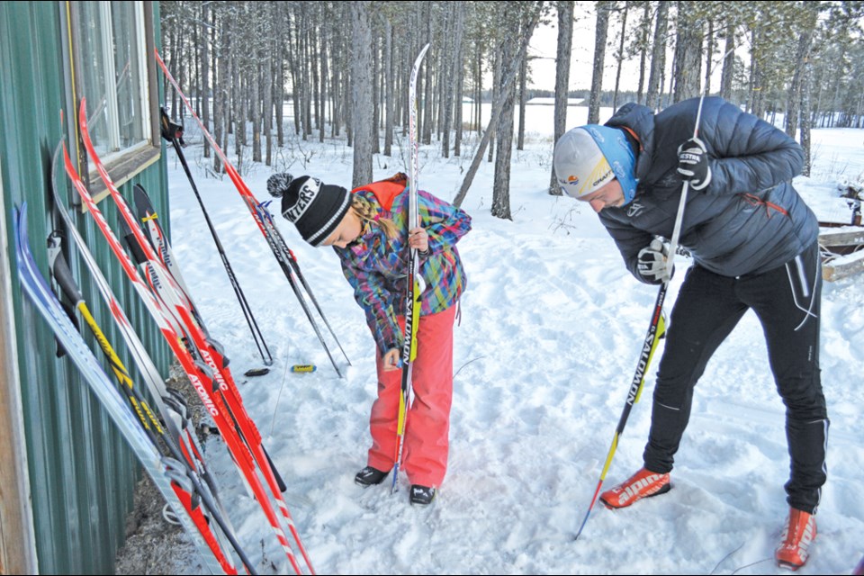 Andrew Brisbin and Brenna Zwozda wax the Jackrabbit’s cross country skis Jan. 10. Review Photo/Emma Meldrum