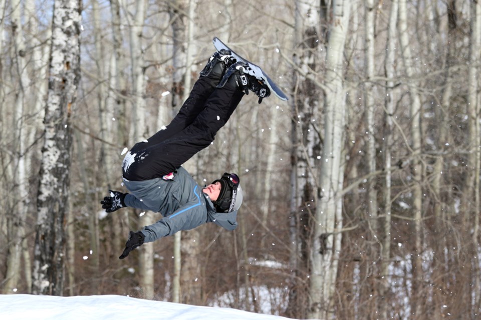 A massive air bag brought by the Saskatchewan Snowboard Association to Wapiti Ski Resort allowed snowboarders to try new tricks with minimal risk of injury. Review Photo/Devan C. Tasa