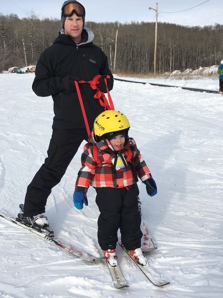 Attending the Little Ducks program at the Duck Mountain ski hill on January 15 was Emmett Kitchen of Kamsack, being assisted by his father Kevin.