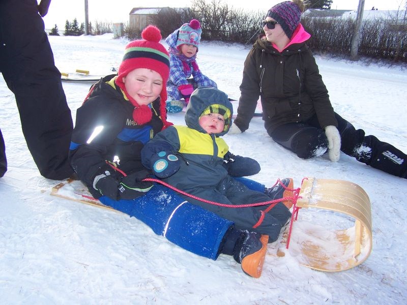 The sliding hill at Norquay was alive with youngsters last week and ready to take a ride on a toboggan were brothers Michael, left, and Will Salisbury, while waiting their turn at back was Jaxslynn Ramsay with Jordan Musey.