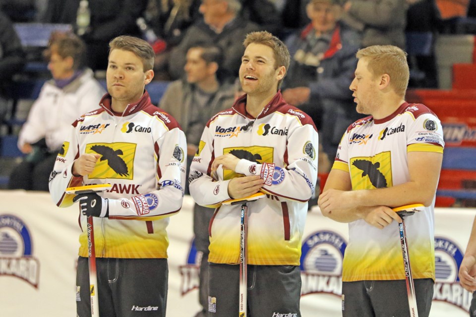 Team Laycock has a brief relaxing moment during the game against Team Casey.