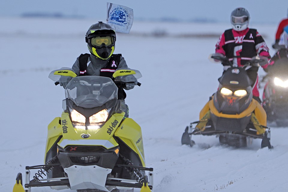 The Prairie Women on Snowmobiles, 10 women who did a six-day trek on snowmobiles to promote awareness of breast cancer and fundraise for research for the disease, arrive at their final stop, Star City. Review Photo/Devan C. Tasa