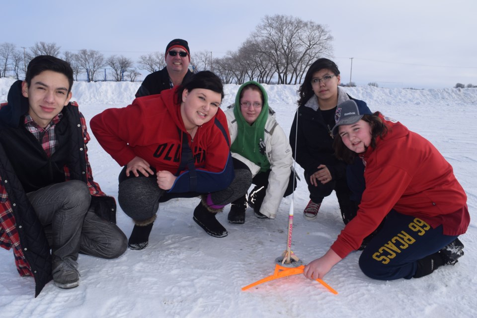 With 2nd Lt. Wade Stachura (at back) instructing, members of the Canora air cadet squadron who helped blast model rockets into the sky on January 28, from left, were: Juan Mesa, Hayley O’Conner, Joanne Babb, Ava Tourangeau (Kamsack cadet) and Cheyanne O’Connor.