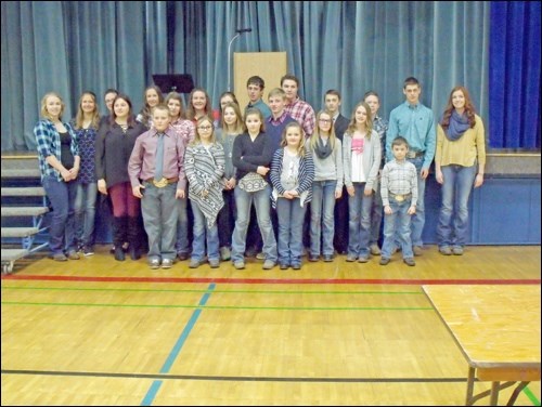 Members of Crown Hill 4-H Beef Club reciting the 4-H pledge at their public speaking competition in Hafford Feb. 12. Photos by Lorraine Olinyk