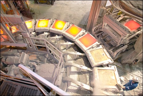 Inside the copper smelter in the 2000s, with copper anodes being cast.