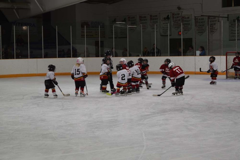 The puck dropped during the exhibition game between the IP Flyers in white jerseys and the IP Cobras, wearing red.