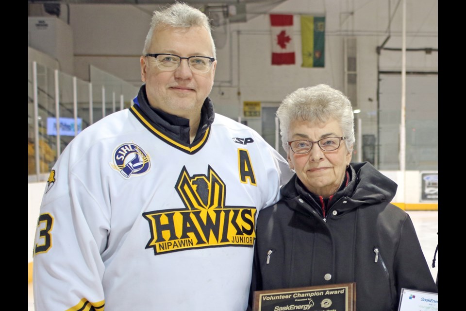 Marj Mosian, right, was recognized for her volunteer efforts for the Hawks with a SaskEnergy Volunteer Champion Award Feb. 17. Beside her is Tim Verklan, a member of the Hawks' board. Review Photo/Devan C. Tasa