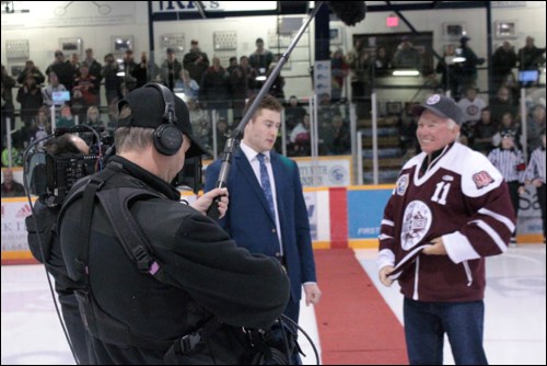 Wearing his no. 11 Bomber jersey, Bobby (Bob) Clarke is filmed at centre ice at the Whitney Forum.