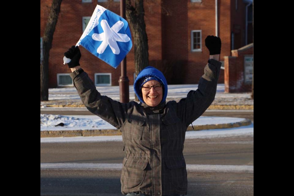 Glenda Gascho, Board Member at Yorkton Transitional Home for Youth, directs walkers at the Coldest Night of the Year. The charity event aims to support homeless people in the city of Yorkton.