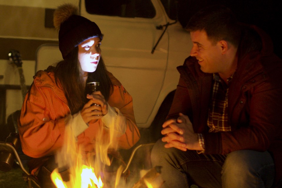 telling scary stories at the campfire (from