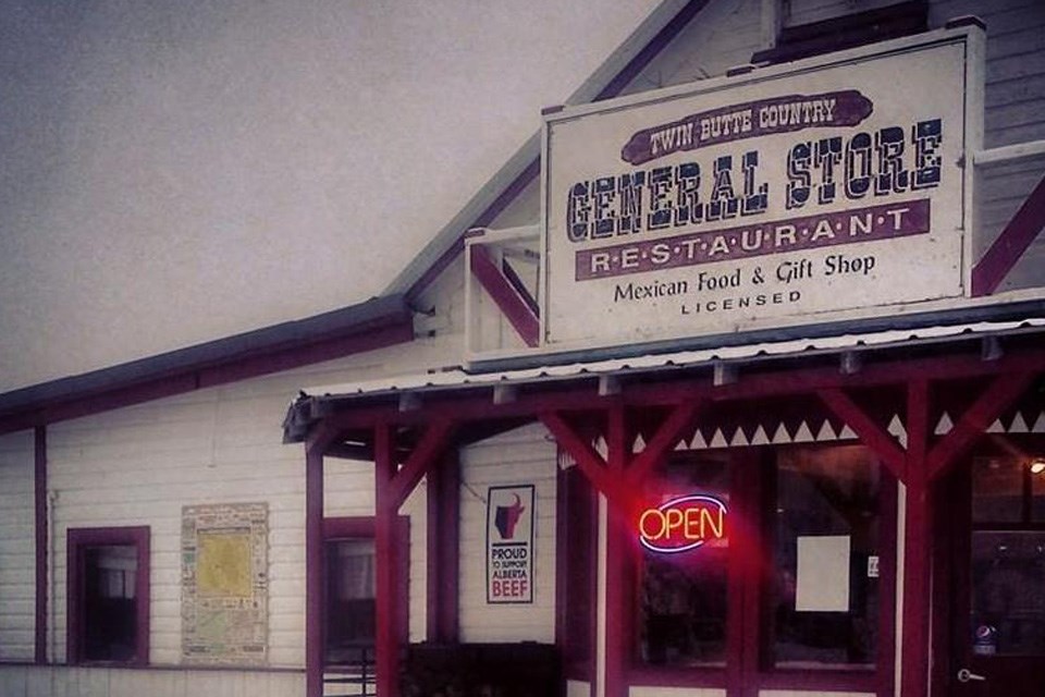 The exterior of the quaint little Twin Butte Country General Store on a winter day. / Twin Butte Country General Store | Facebook