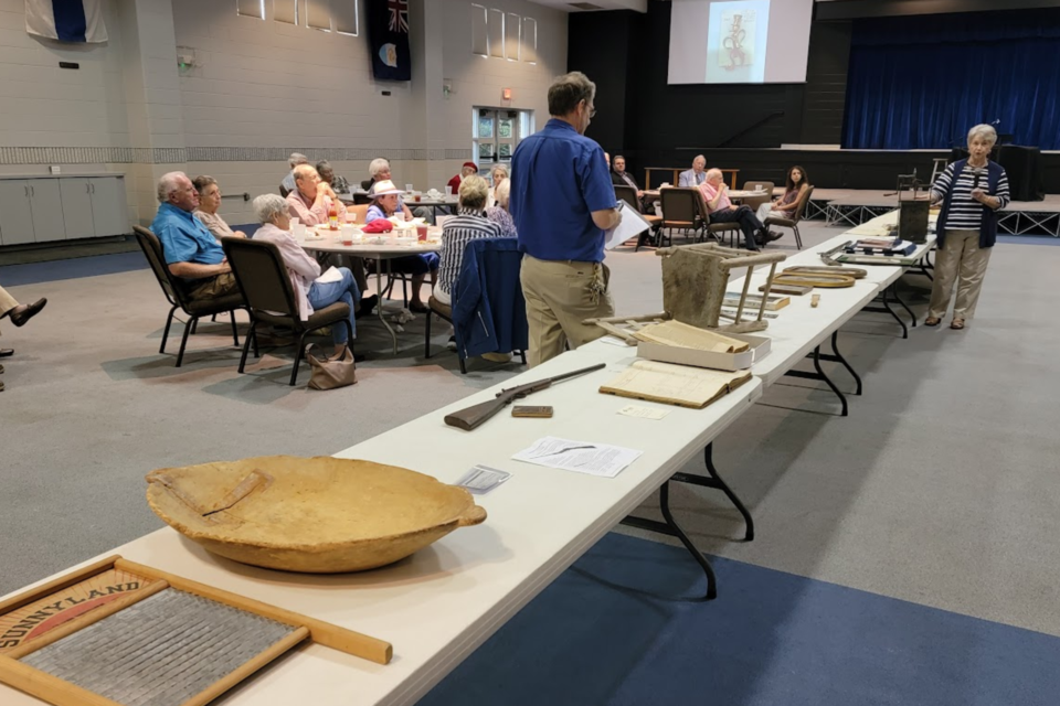 Bonnie Howard shared her butter churn with the members