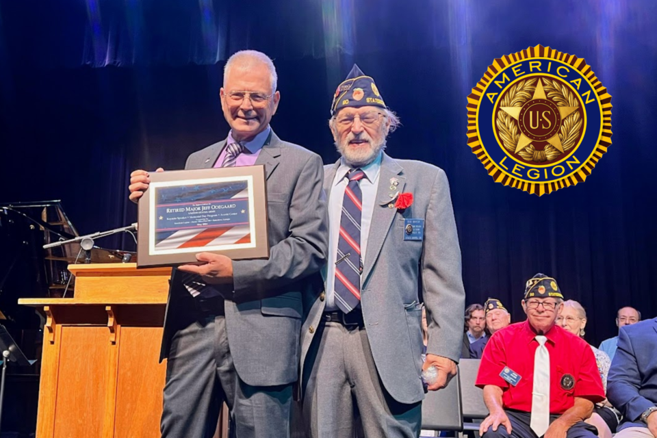 Major Jeff Odegaard (L) receives plaque from Bob Marsh (R)
