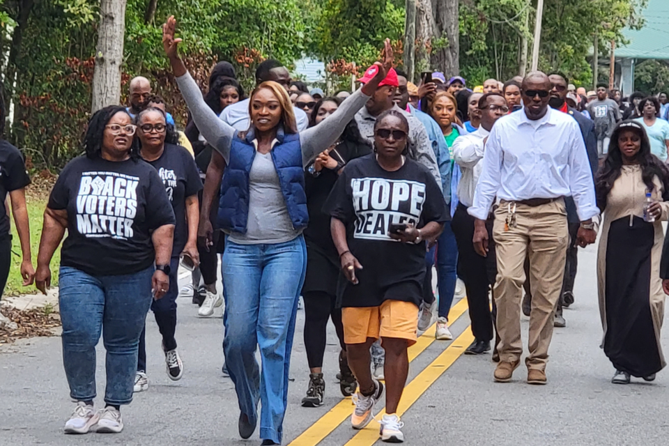 District 2 Council member Paulette Chavers waves as she leads the walk through her district