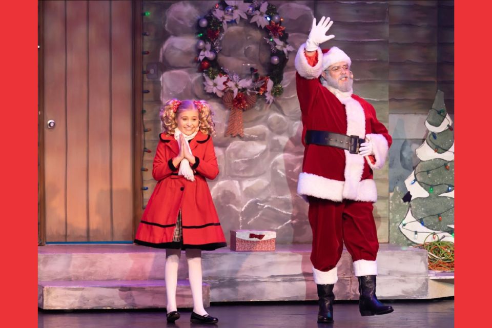 Emma-Charles Townsend on stage with Old St. Nick