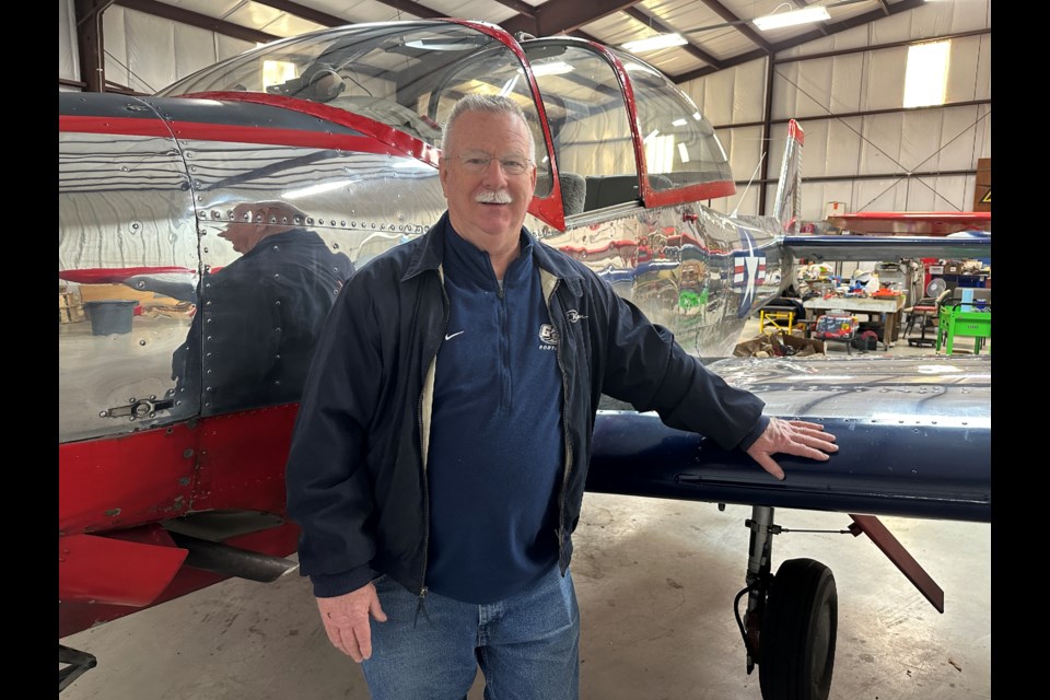 Dr. Russell "Rusty" Herrington poses with his Navion.