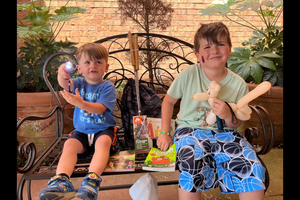 Kids enjoying their books and prizes