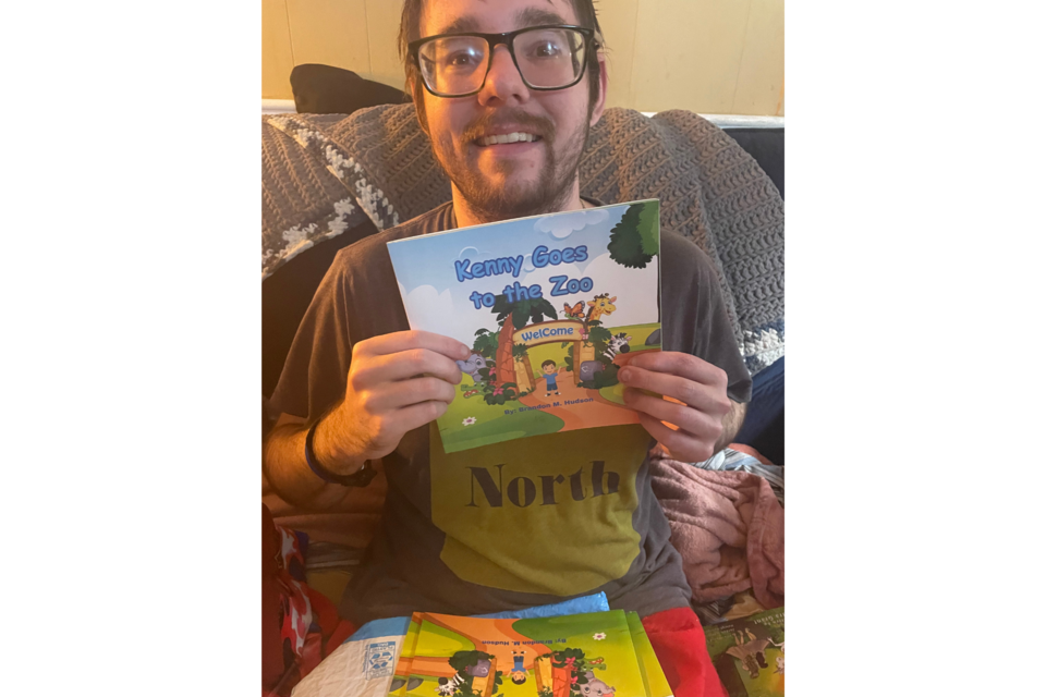 Brandon with his newly published book, Kenny Goes to the Zoo.