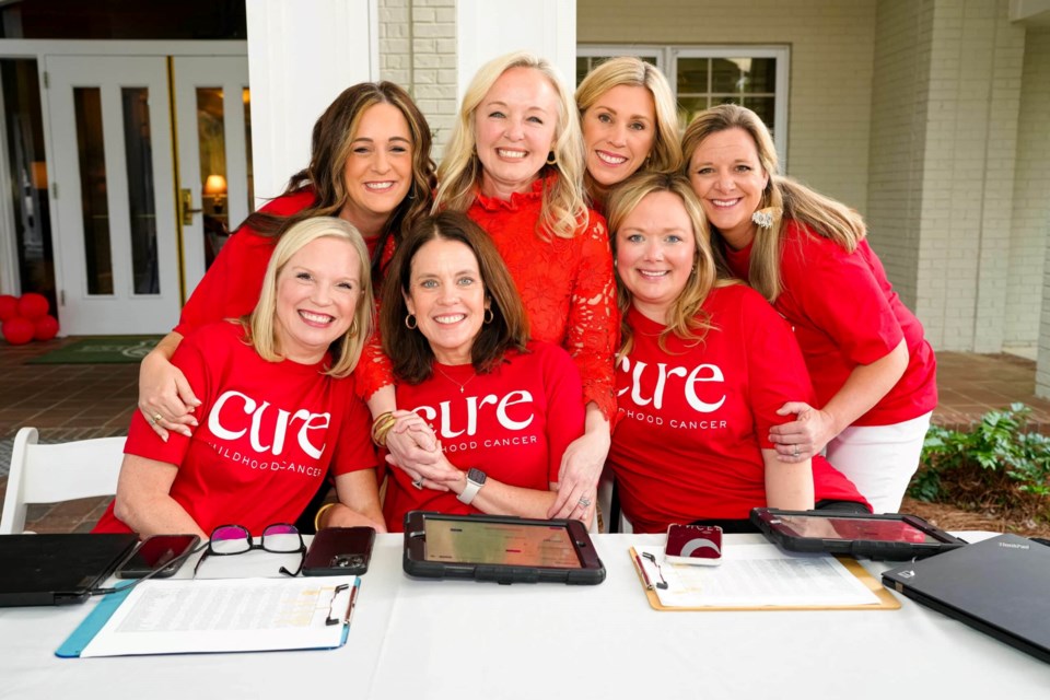 Jody Polk, center, is a local mom of a childhood cancer survivor and organized the event with friends and volunteers.