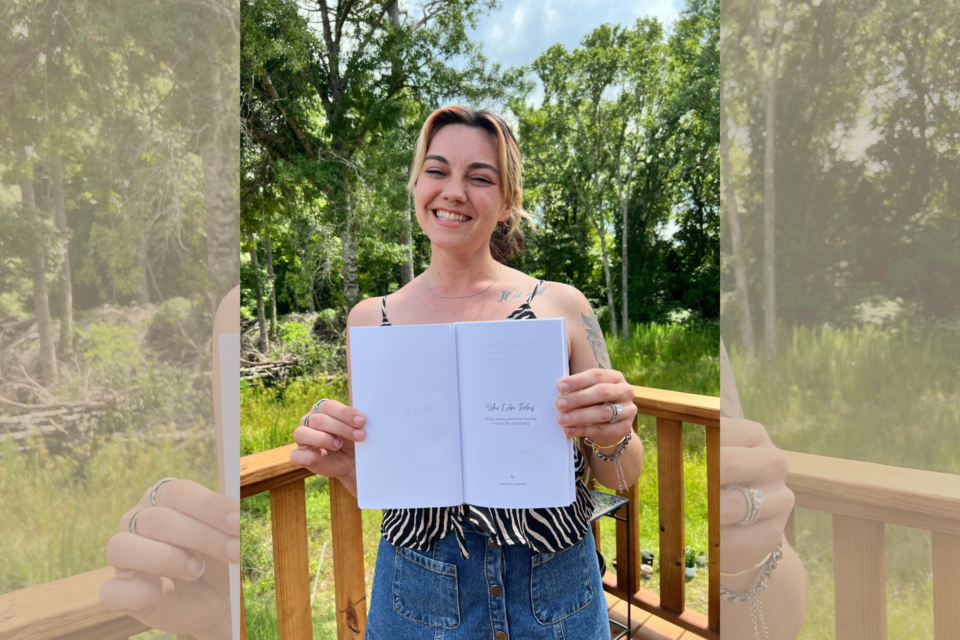 julianna-leverette-holding-her-self-published-book-for-the-first-time