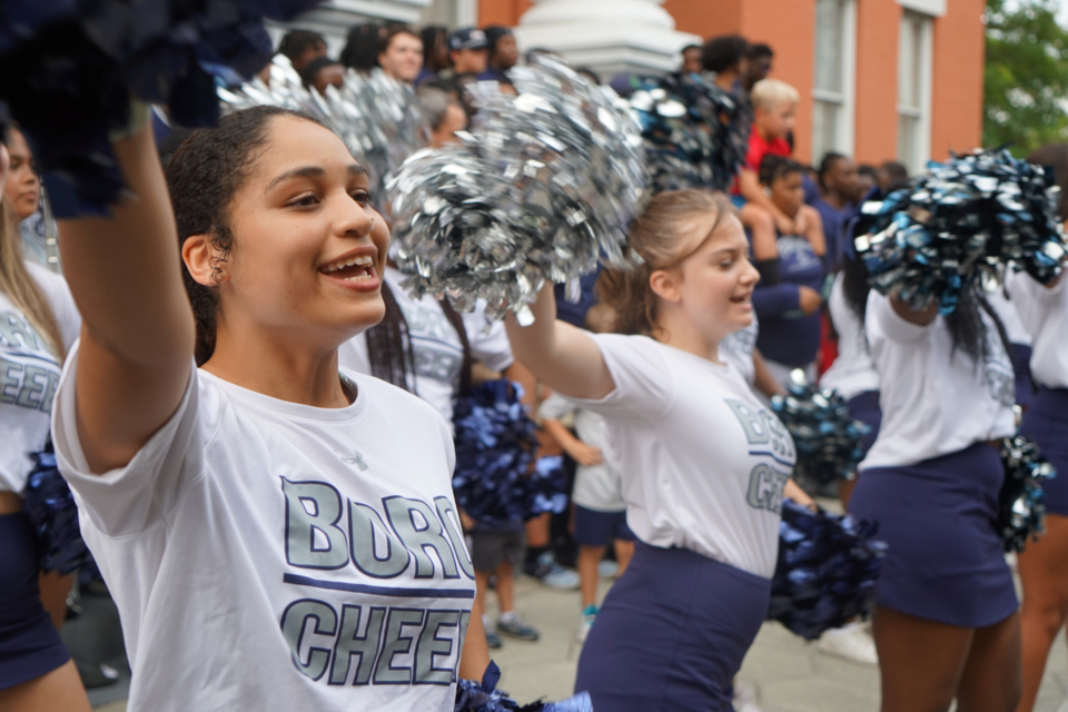 Statesboro High School cheerleaders fire up the crowd with spirited chants.