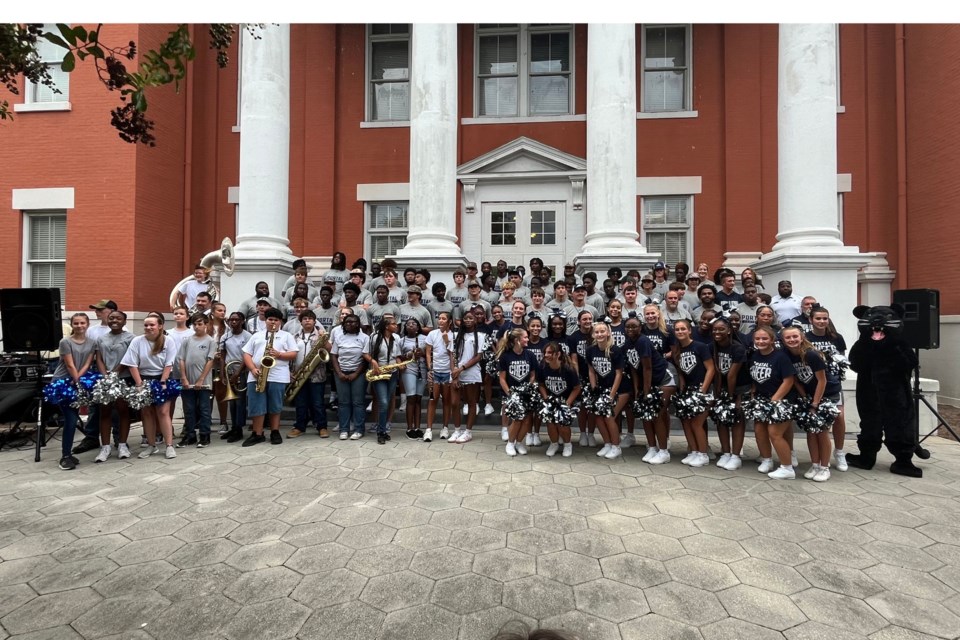 Portal High School Football and Cheer team with their band