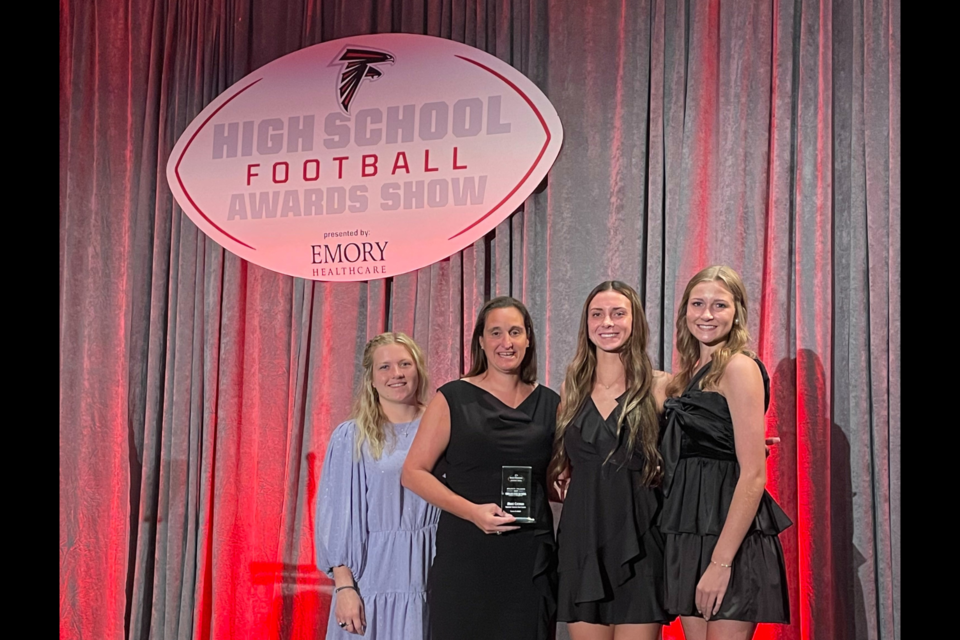 Abigail Morgan, Coach Marci Cochran, Delanie Thames, and Lauren Erickson