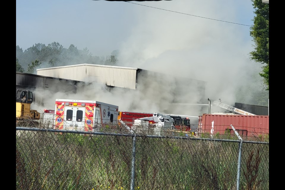 Firefighters battling large trash fire