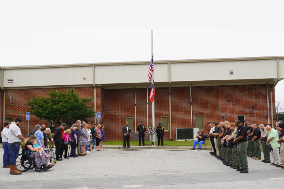 Sheriff Noel Brown, law enforcement members and Berry's family at the service