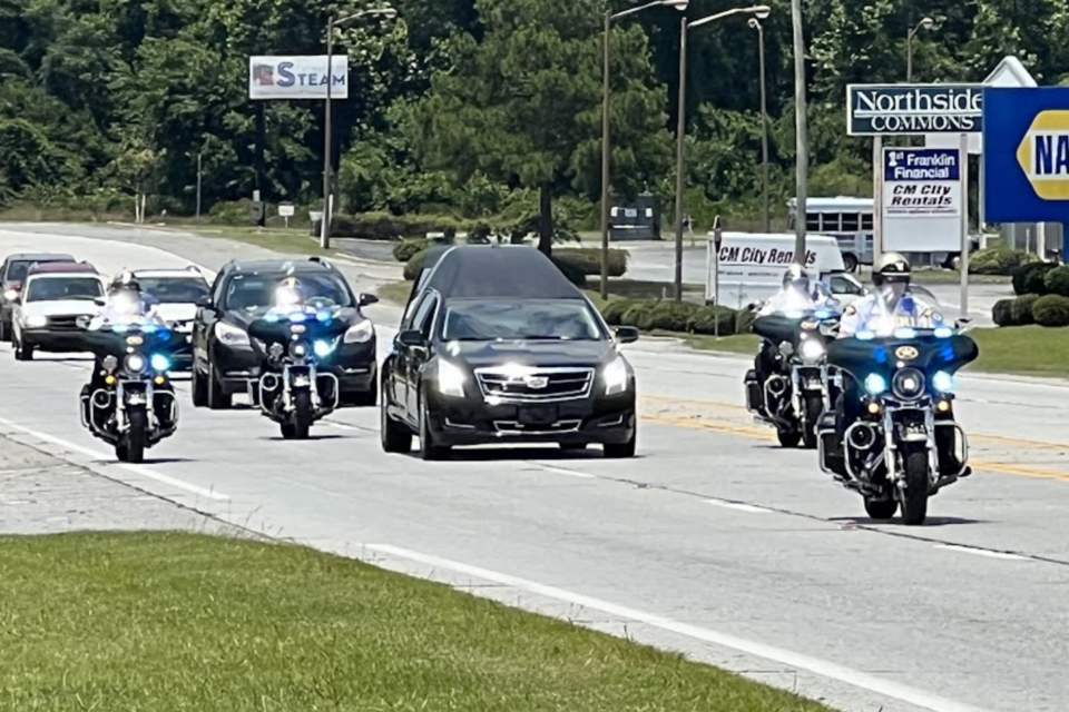 Bulloch County Sheriff's escort team surrounding the hearse