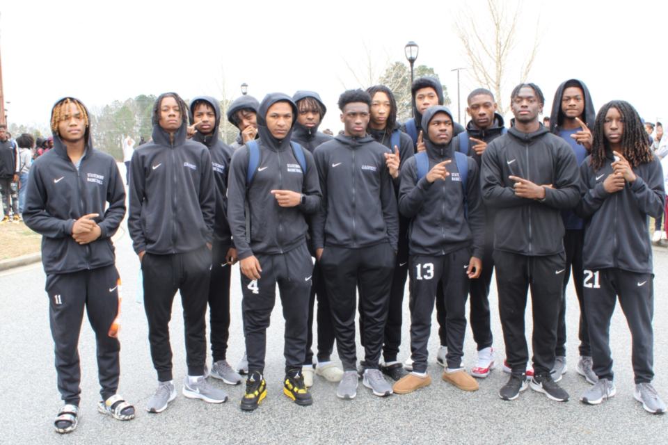 SHS varsity men’s basketball poses for a photo at send-off
