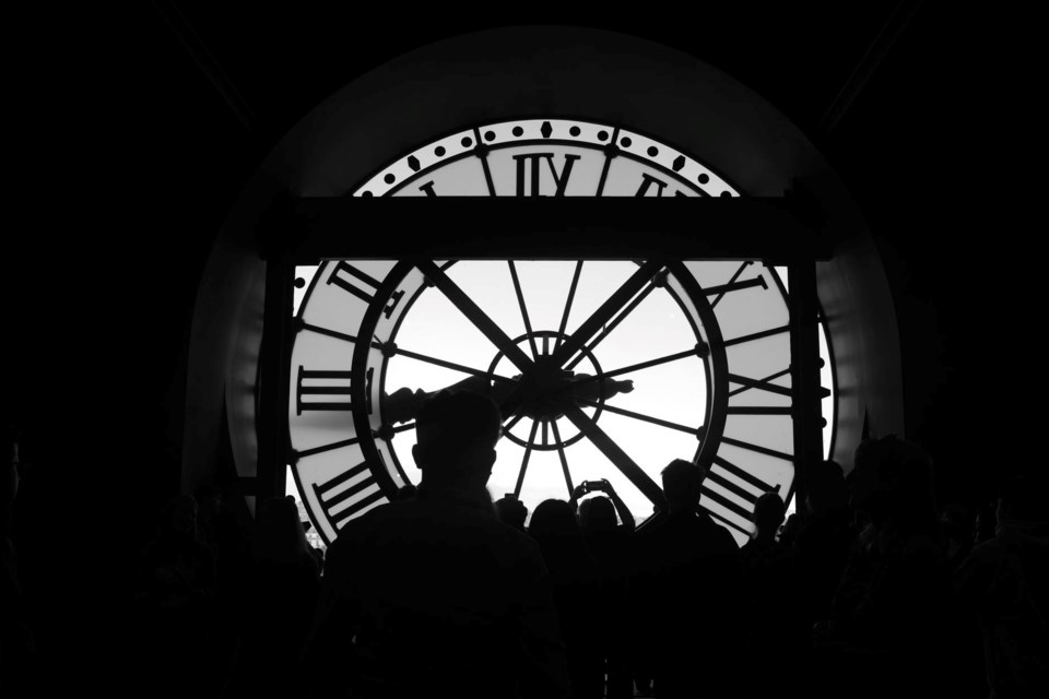 silhouette of people standing in front of glass window