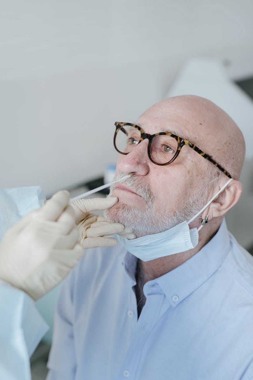 a person doing nasal swab test COVID At Home
