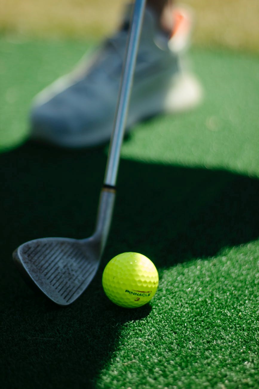 golf player preparing to hit ball